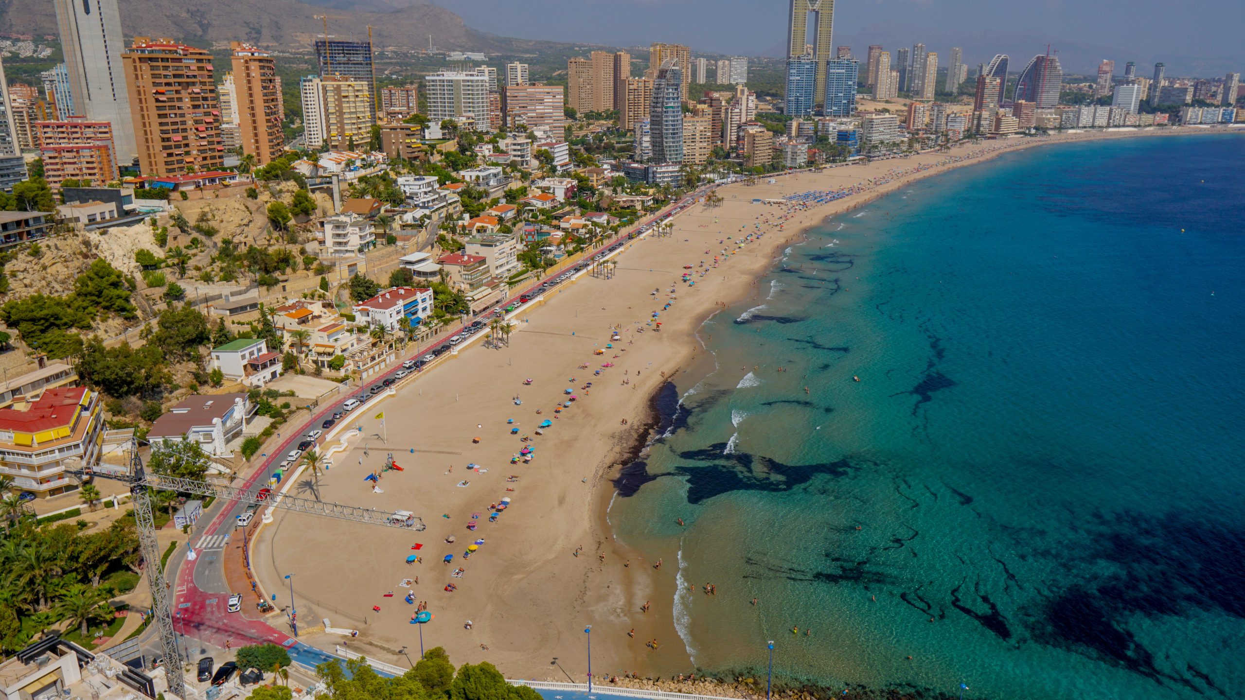 Beautiful cityscape view on the coast of the blue sea against a blue sky